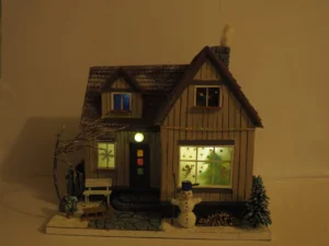 Pohled na noční osvícený papírový model domu By MOPSL